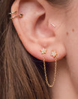 Broquel doble estrella con zirconia y cadena colgante