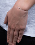 Pulsera de hilo con cruz lisa